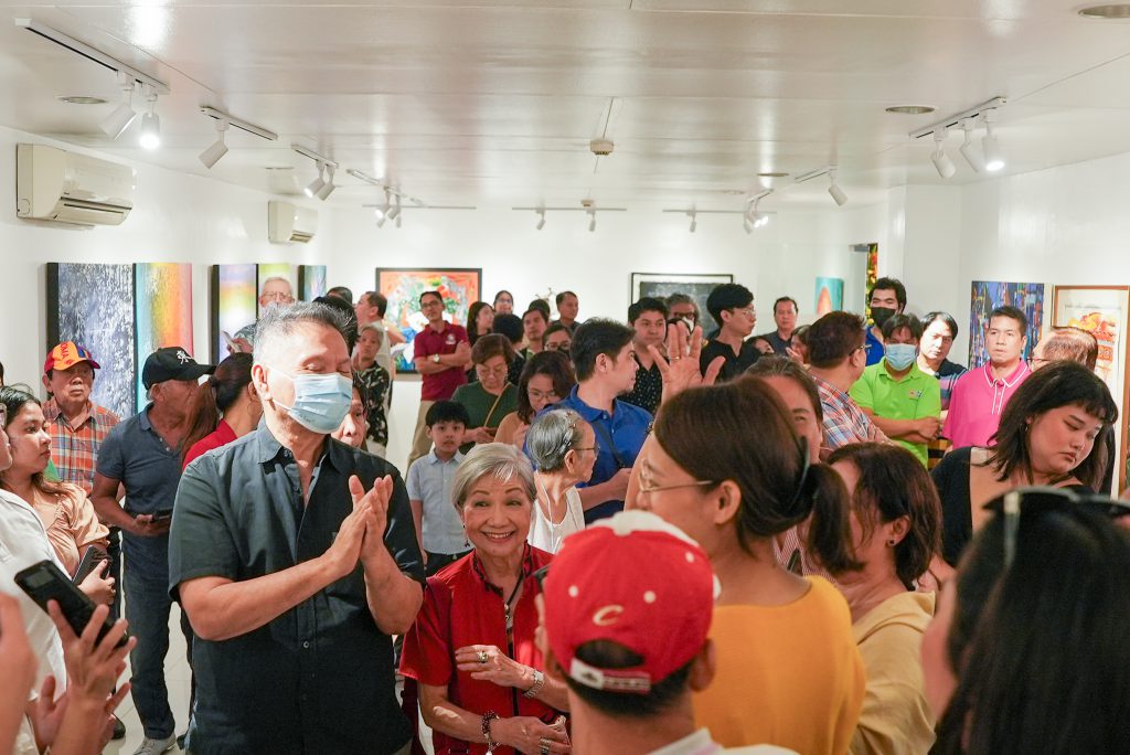 Guests take a look at the new artworks for the Year-Ender exhibition at the White Room Gallery.